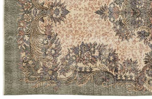 Load image 1 in gallery view. Sage green and beige traditional rug with a distressed floral medallion pattern and ornate border.