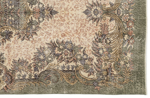 Load image 1 in gallery view. Sage green and beige rug with a traditional floral medallion pattern and distressed, vintage-style finish.