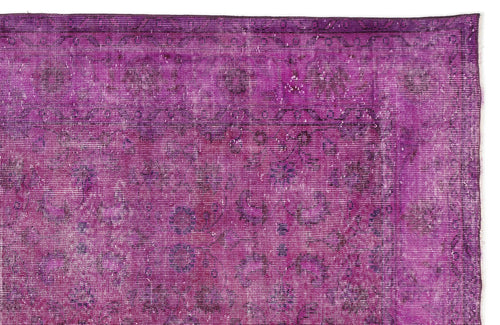 Load image 1 in gallery view. Magenta vintage-style rug with a distressed, faded traditional floral medallion pattern on a white background.
