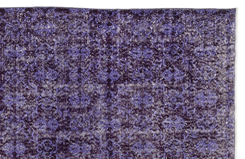 Load image 1 in gallery view. Deep purple and lavender distressed rug with a repeating floral medallion pattern on a white background.