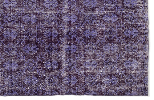 Load image 1 in gallery view. Deep purple and lavender distressed rug with a repeating floral medallion pattern.