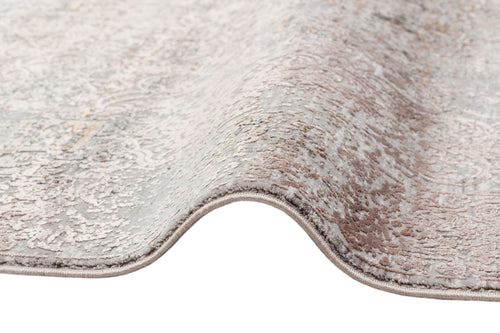 Load image 1 in gallery view. Grey and taupe rug with a distressed, faded traditional medallion pattern and a finished serged edge.