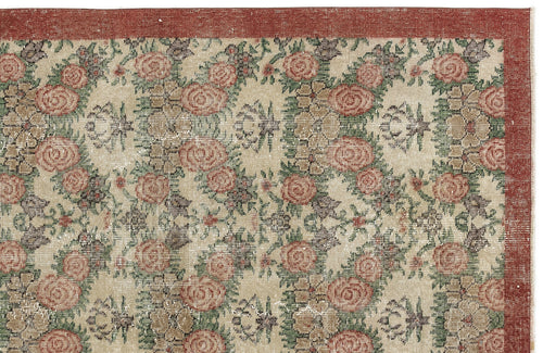Load image 1 in gallery view. Beige rug with a repeating floral pattern in red and green, featuring a solid red border.