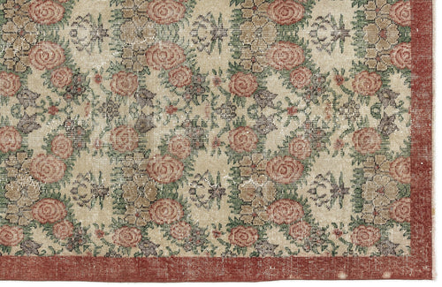 Load image 1 in gallery view. Beige rug with a distressed floral rose pattern in red and green, featuring a solid red border.