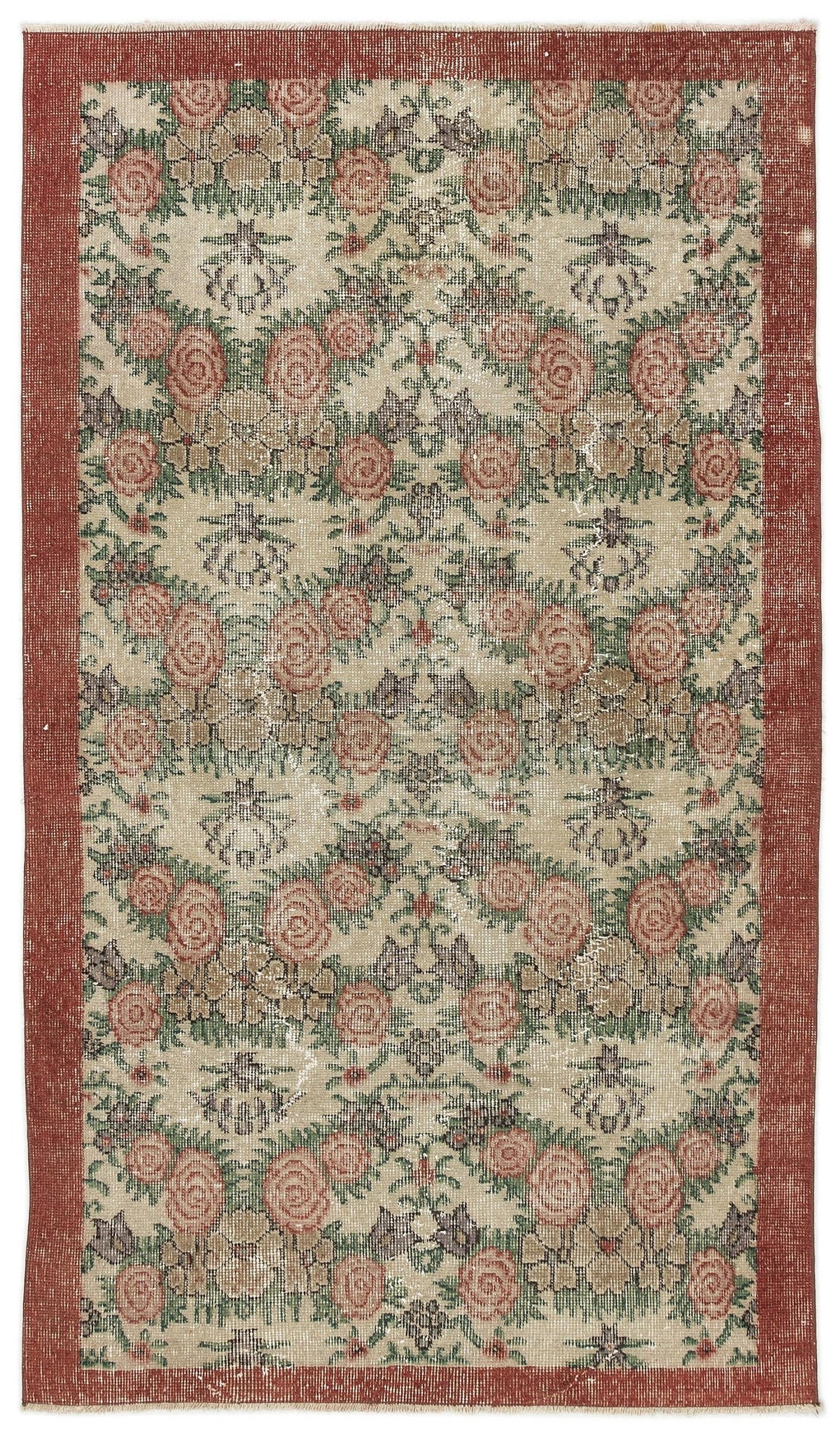 Distressed beige rug with a repeating floral rose pattern in red and green, framed by a solid red border.
