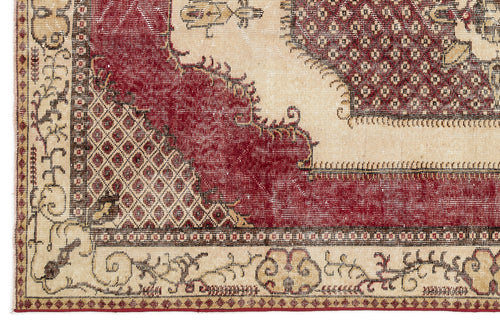 Load image 1 in gallery view. Distressed red and beige rug with a traditional medallion pattern, geometric lattice details, and a floral border.