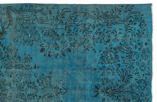 Load image 1 in gallery view. Teal rug with a distressed black floral medallion pattern on a white background.