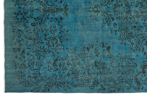 Load image 1 in gallery view. Teal rug with a distressed black floral medallion pattern and visible woven texture.
