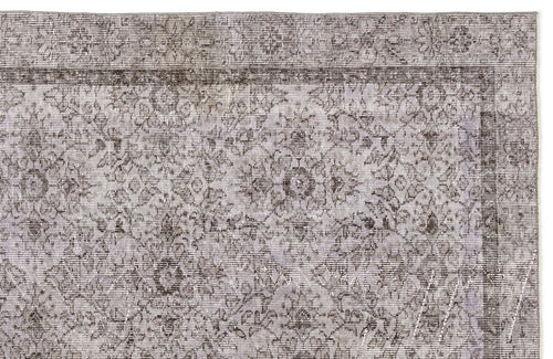 Load image 1 in gallery view. Grey and brown distressed rug with a traditional floral medallion pattern and a bordered edge.