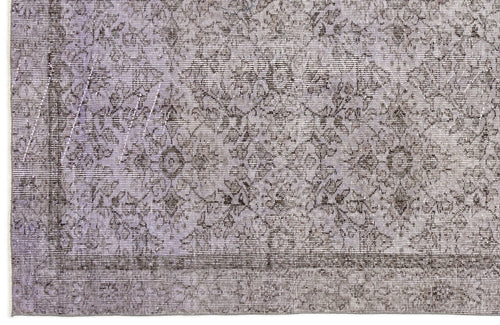 Load image 1 in gallery view. Lavender and charcoal grey rug with a distressed, traditional floral medallion pattern and a bordered edge.