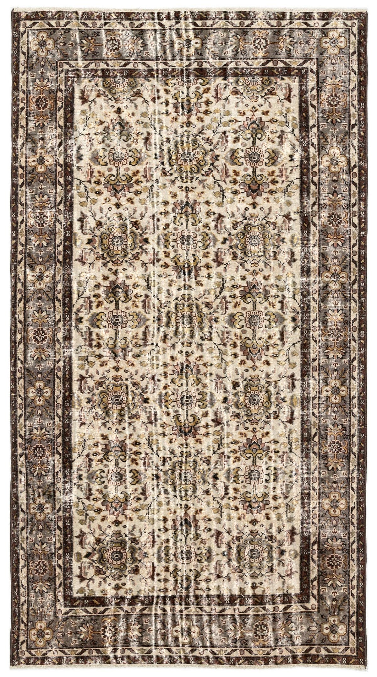 Cream and brown traditional rug with a repeating floral medallion pattern and a dark decorative border.