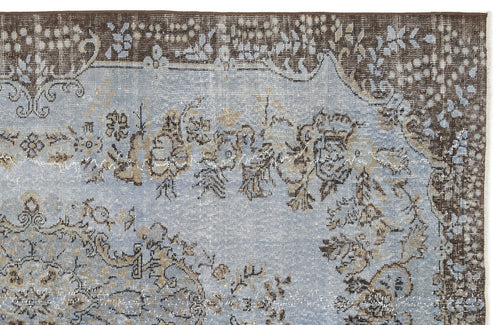 Load image 1 in gallery view. Distressed light blue rug with a dark brown border and intricate floral medallion pattern.