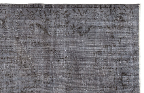 Load image 1 in gallery view. Charcoal grey vintage-style rug with a faded, distressed floral medallion pattern and a detailed border.