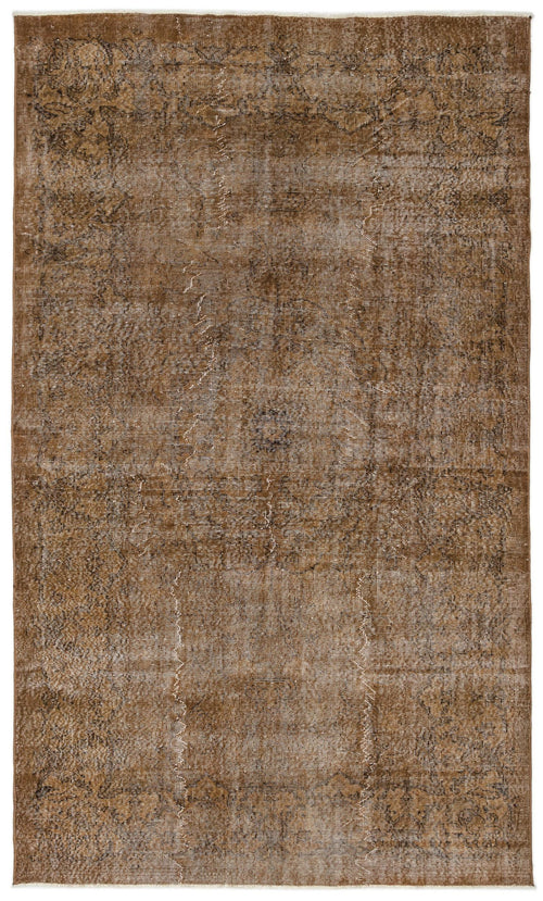 Load image 1 in gallery view. Brown distressed vintage-style rug with a faint, faded traditional medallion pattern.