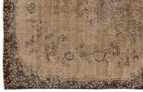 Load image 1 in gallery view. Distressed brown and dark espresso rug with a faded floral medallion pattern and a decorative border.