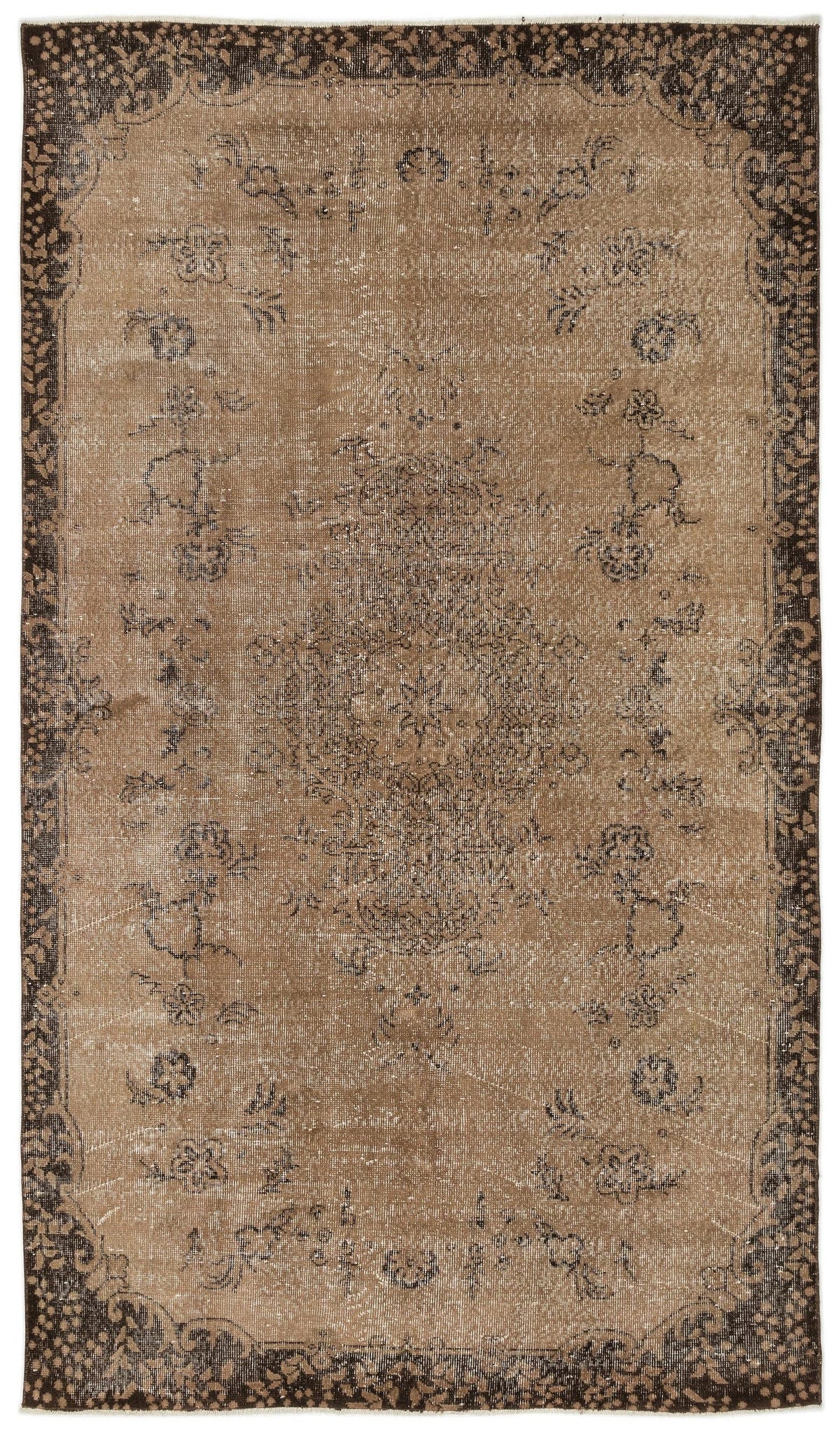 Distressed brown and dark charcoal rug with a central floral medallion and a wide, ornate botanical border.