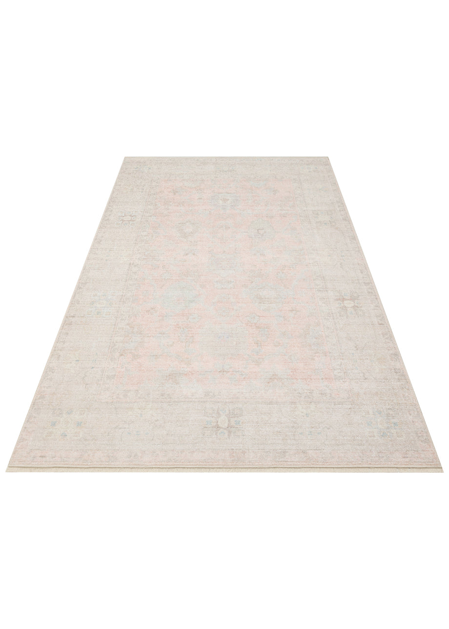 Beige and pale pink traditional area rug with a faded medallion pattern and distressed finish on a white background.