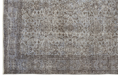 Load image 1 in gallery view. Grey and charcoal distressed traditional rug with an intricate floral medallion pattern and a bordered edge.