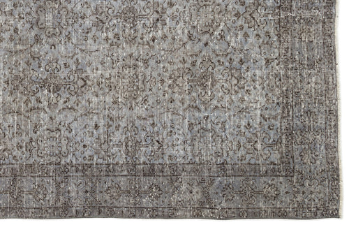 Load image 1 in gallery view. Grey and charcoal distressed rug with a faded traditional floral medallion pattern and a bordered edge.