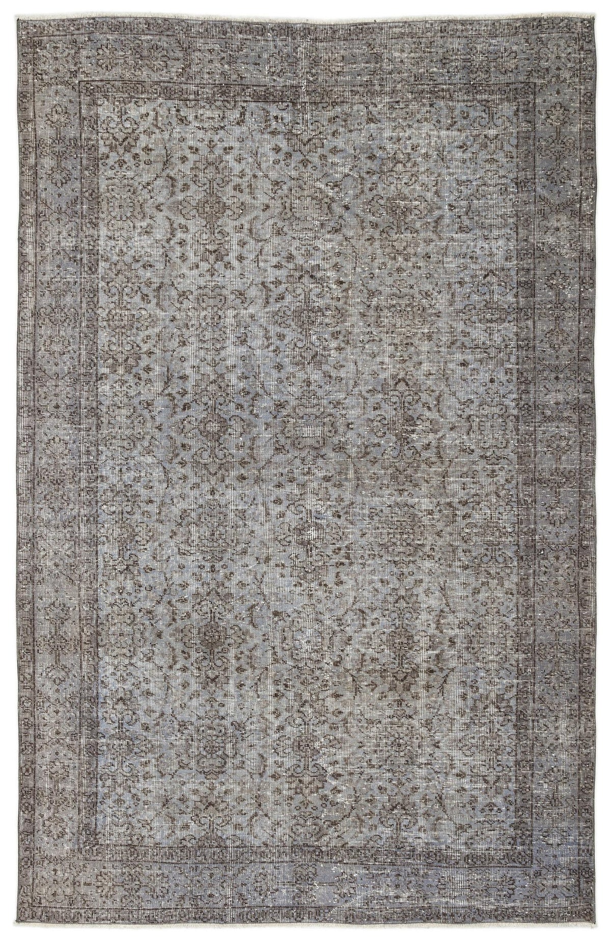 Distressed grey and charcoal rug with a traditional floral medallion pattern and a bordered edge.