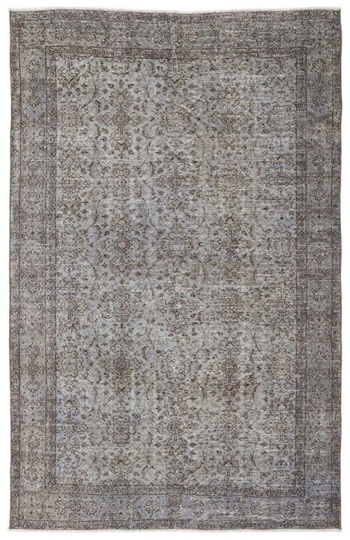 Load image 1 in gallery view. Distressed grey and charcoal rug with a traditional floral medallion pattern and a bordered edge.
