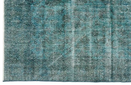 Load image 1 in gallery view. Teal and charcoal distressed rug with a faded traditional floral medallion pattern.