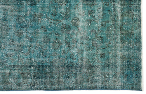Load image 1 in gallery view. Teal and black distressed rug with a faded traditional floral pattern.