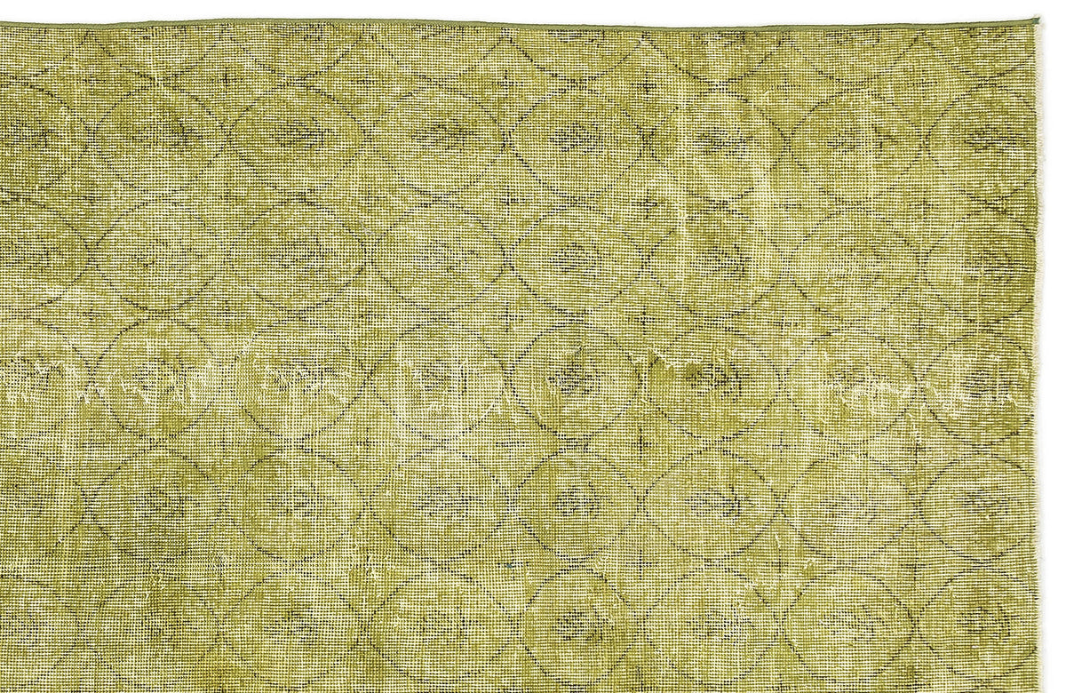Olive green rug with a distressed, repeating circular lattice pattern.