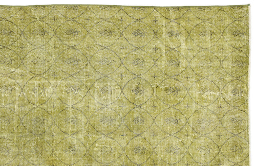 Load image 1 in gallery view. Olive green rug with a distressed, repeating circular lattice pattern.