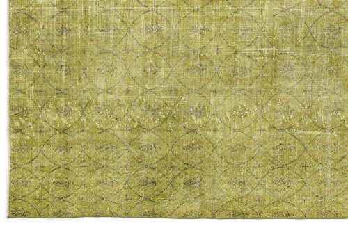 Load image 1 in gallery view. Olive green rug with a distressed, repeating circular lattice pattern.