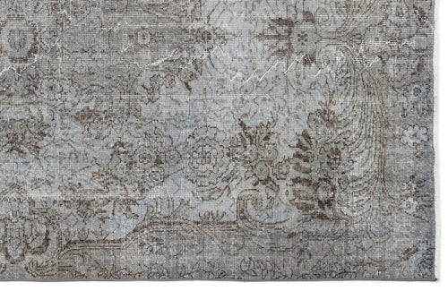 Load image 1 in gallery view. Grey and slate blue distressed rug with a traditional floral medallion pattern.