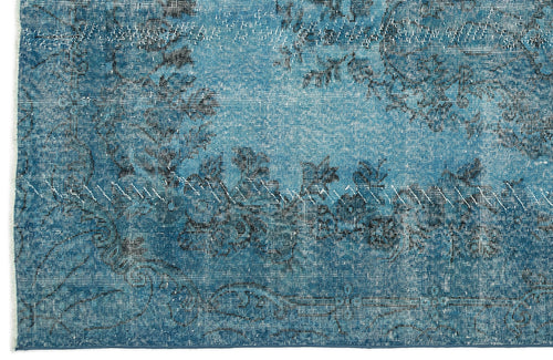 Load image 1 in gallery view. Teal and blue distressed rug with a faded floral pattern and visible white stitched repair lines.