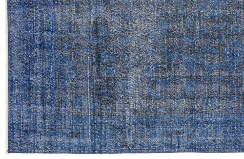 Load image 1 in gallery view. Navy and white distressed rug with a faded traditional medallion pattern and fringed edge.