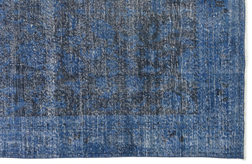 Load image 1 in gallery view. Navy and royal blue distressed rug with a faded traditional medallion pattern and a bordered edge.