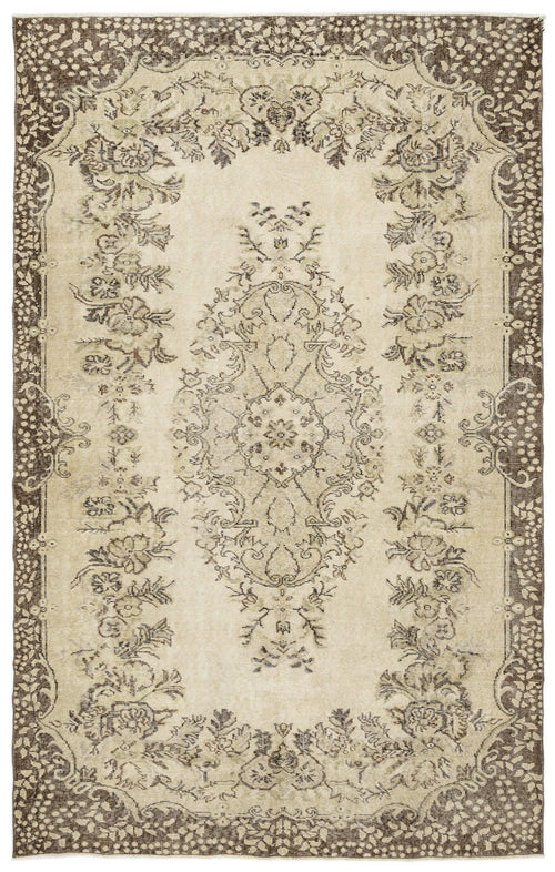 Load image 1 in gallery view. The Coveis Vintage Medallion Rug (5'10 x 9'4) is a rectangular beige rug with an ornate, symmetrical floral pattern in brown and cream hues, highlighted by a decorative border and a detailed central medallion.