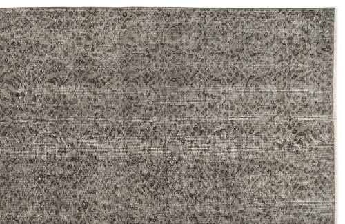 Load image 1 in gallery view. Charcoal and grey distressed rug with a faded, intricate traditional floral pattern.