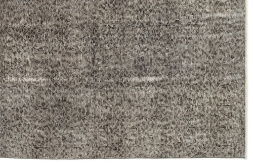 Load image 1 in gallery view. Charcoal and grey distressed rug with a faded, intricate traditional medallion pattern.