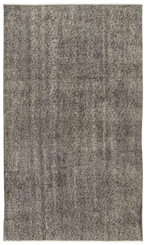 Load image 1 in gallery view. Charcoal and grey distressed rug with a faded, intricate traditional floral medallion pattern.
