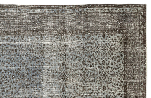 Load image 1 in gallery view. Charcoal and slate blue distressed rug with a traditional ornate medallion pattern and a geometric border.