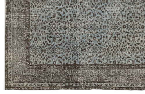 Load image 1 in gallery view. Distressed slate blue and dark brown rug with an intricate floral medallion pattern and a wide decorative border.