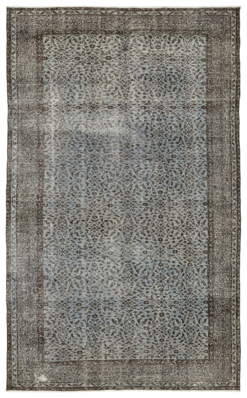 Load image 1 in gallery view. Distressed charcoal and light blue rug with an intricate repeating floral pattern and a wide border.