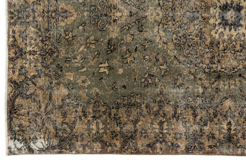 Load image 1 in gallery view. Distressed olive green and brown rug with a traditional floral medallion pattern and faded, worn texture.