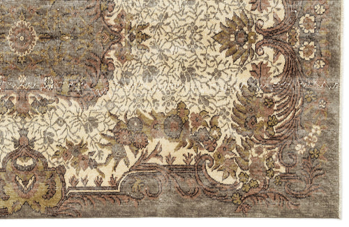 Load image 1 in gallery view. Distressed olive, brown, and cream rug with a traditional floral medallion pattern and ornate border.