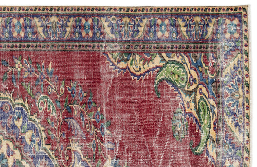 Load image 1 in gallery view. Distressed red traditional rug with blue, green, and beige floral paisley borders and central medallion motifs.