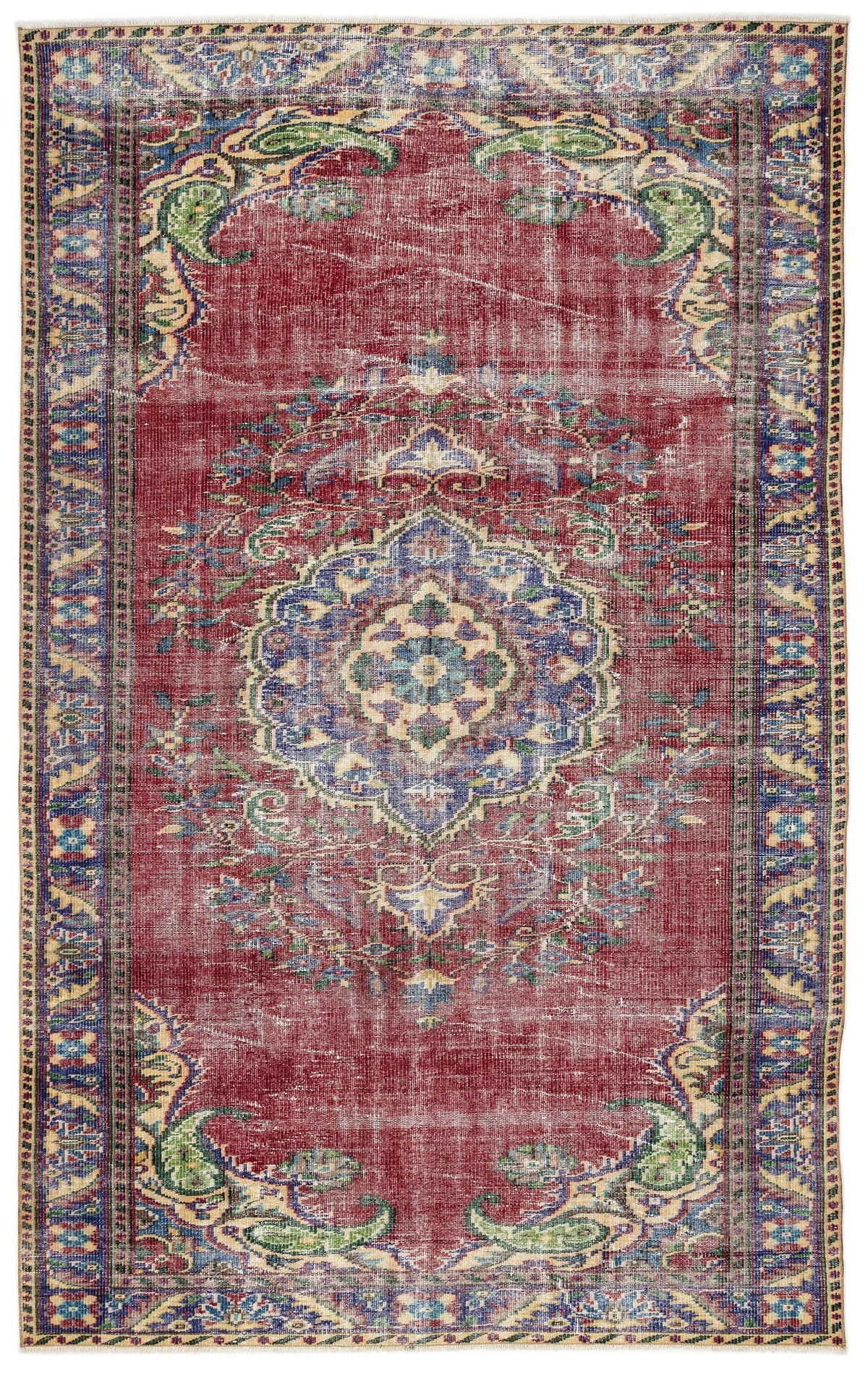 Distressed red traditional rug with a central blue and cream floral medallion and ornate border on a white background.