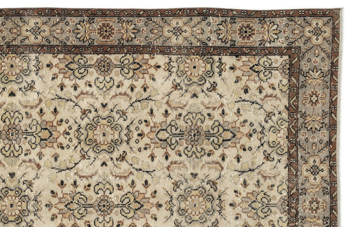 Load image 1 in gallery view. Beige, brown, and grey traditional rug with a distressed floral medallion pattern and a detailed border.