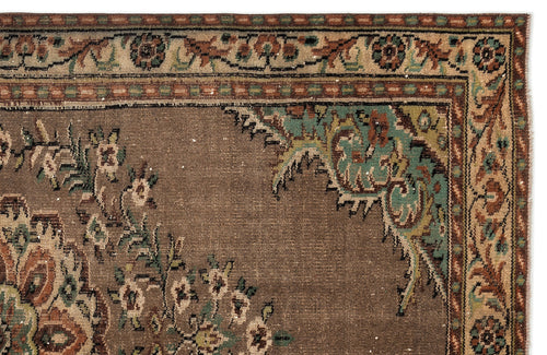 Load image 1 in gallery view. Brown traditional rug with a teal and rust floral border and corner medallion detail on a white background.