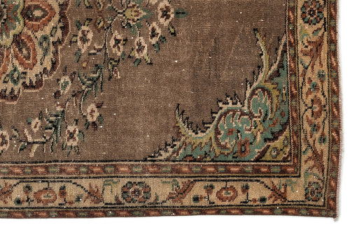Load image 1 in gallery view. Brown traditional rug with a floral medallion pattern in teal, cream, and rust, featuring a detailed decorative border.