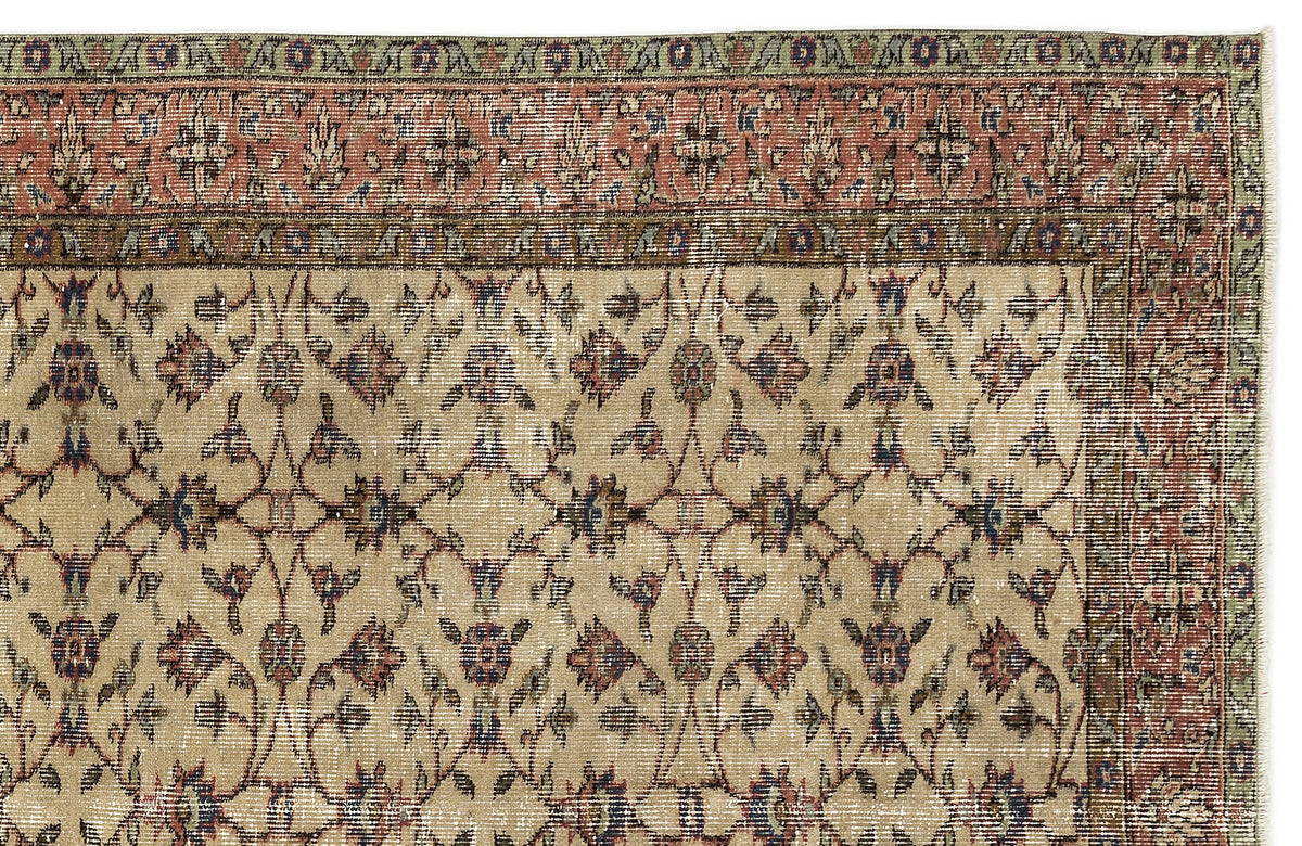 Beige traditional rug with a distressed floral vine pattern, red and green border, and a white background.