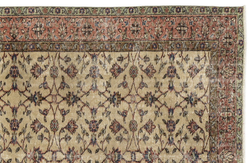 Load image 1 in gallery view. Beige traditional rug with a distressed floral vine pattern, red and green border, and a white background.